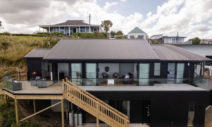 Kai Iwi Casa | Sunset Delight. Beautiful home with expansive sea views.