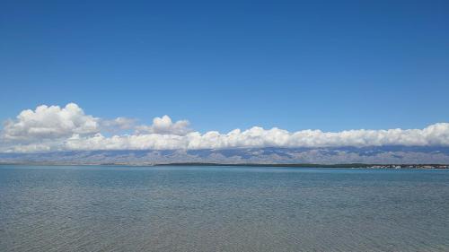 Nin Apartamento | Sunset view at the sandy beach - Nin luxury apartment