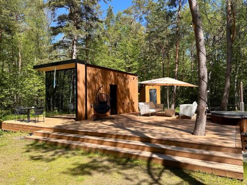 Laane-Nigula Parish Casa | Telise TinyOne is a modern forest cabin with a cozy hot tub