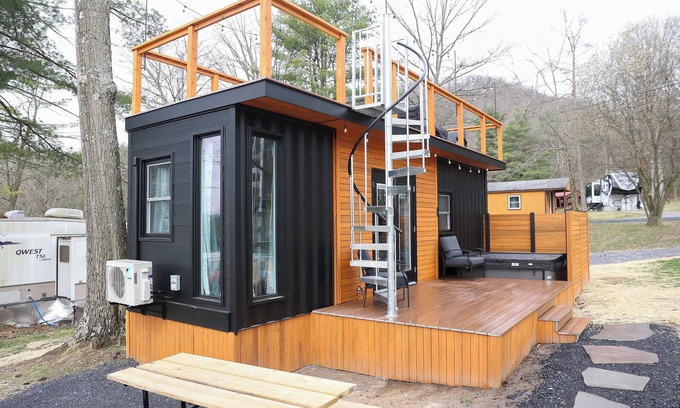 Mingoville Cabina | The Bellefonte Campground presents: The Luxury Hideaway Container Home, hot tub, Rooftop veranda, and more.