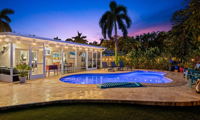 Poinsettia Heights Casa | Welcome to Pelican Landing, A Cozy Tropical Heated Pool Home!