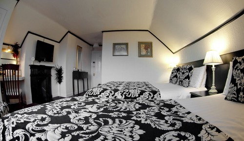 Habitación triple Deluxe, varias camas