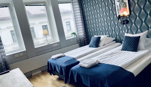 Habitación estándar con 1 cama doble o 2 individuales, baño compartido