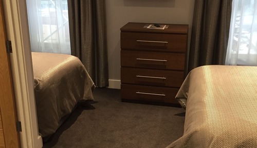 Habitación triple, varias camas