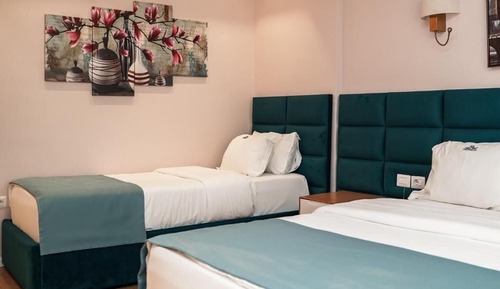 Habitación triple, vistas al mar