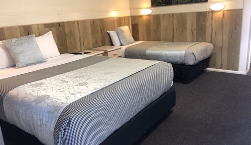 Habitación triple Deluxe, varias camas