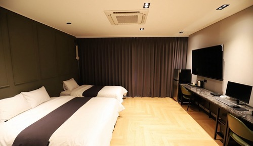 Habitación familiar con 2 camas individuales