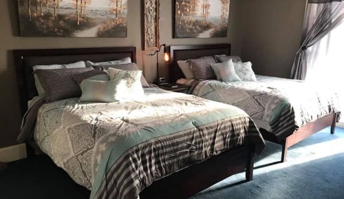 Habitación Confort doble de uso individual, 2 camas de matrimonio, baño compartido