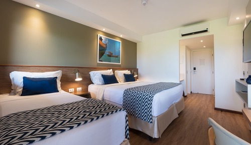 Quarto Standard - 1 cama queen e 1 cama solteiro. Vista jardim ou mangue