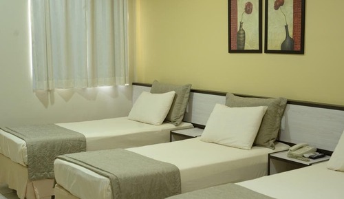 Habitación triple Deluxe, varias camas