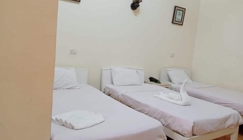 Habitación triple Deluxe, varias camas, vistas a la ciudad