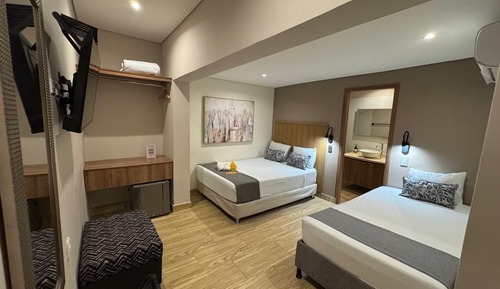 Habitación triple superior, varias camas