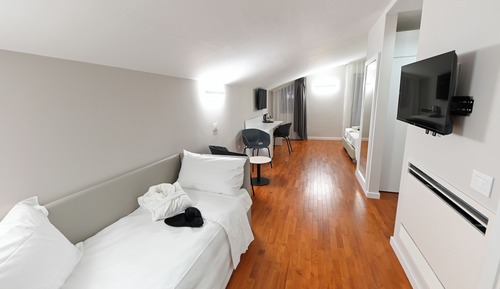 Habitación cuádruple Deluxe, balcón, vistas al patio