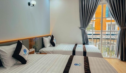 Habitación cuádruple Deluxe, balcón, vistas a la ciudad
