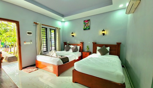 Habitación con 2 camas individuales, vistas al jardín