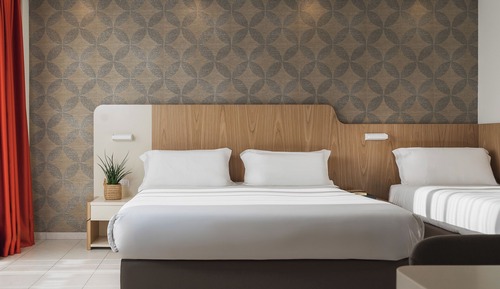 Habitación triple Deluxe, varias camas