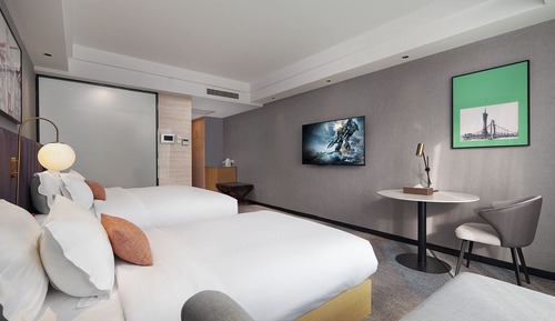 Habitación superior con 2 camas individuales, vistas a la ciudad