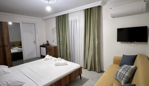 Habitación cuádruple Deluxe, balcón, vistas al jardín