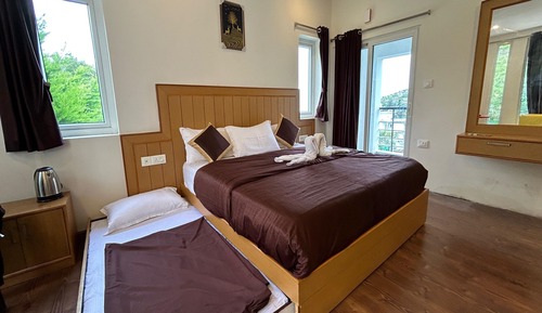 Habitación triple familiar, vistas al jardín