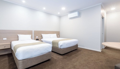 Habitación triple Deluxe, varias camas