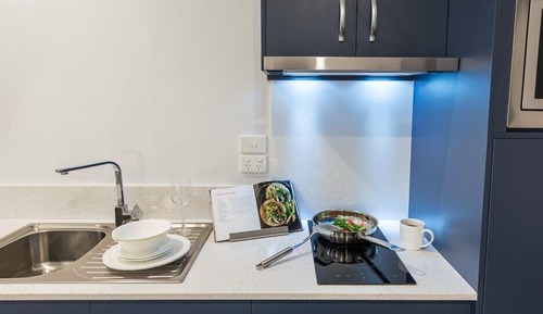Suite familiar, varias camas, cocina básica, en la zona del patio