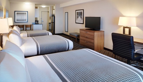 Habitación triple Deluxe, varias camas, cocina