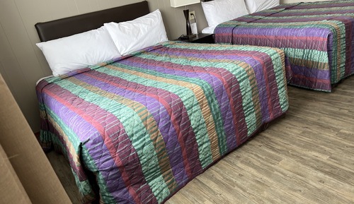 Habitación Deluxe doble, varias camas, cocina básica