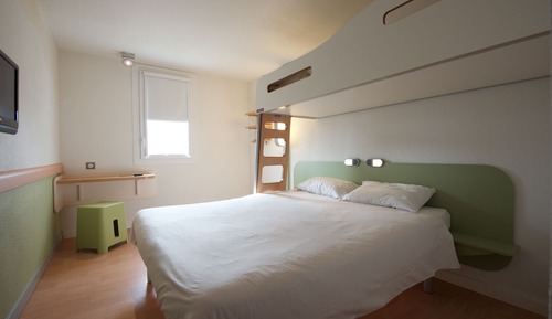Habitación triple, varias camas