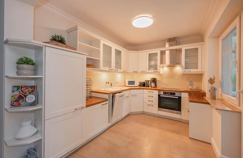 Zinnowitz Apartamento | Quartier am Kirchberg - 02 - quiet residential complex with conservatory and fireplace