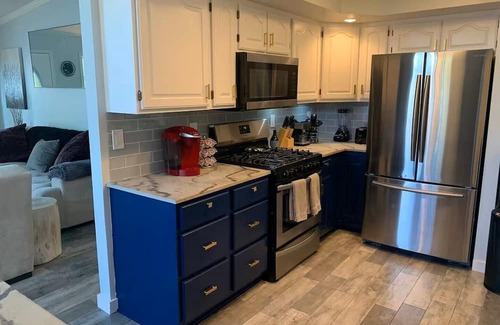 Lynn Center Casa | Best in QC! AweSpired Riverfront Retreat – Hot Tub, Fireplaces & Stunning Views!