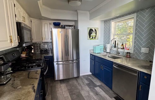 Lynn Center Casa | Best in QC! AweSpired Riverfront Retreat – Hot Tub, Fireplaces & Stunning Views!