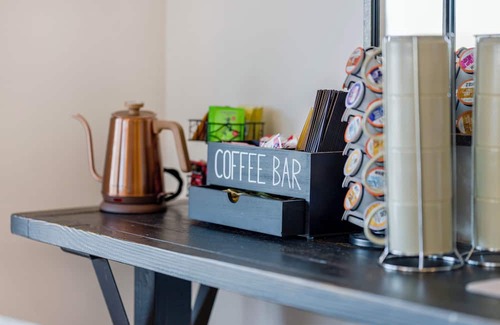 Cambridge Casa | Bright hilltop retreat with stunning mountain views, wrap-around windows, and cozy seating to take it all in. Nestled on a private, scenic property minutes from charming Cambridge village—perfect for a peaceful getaway year-round.