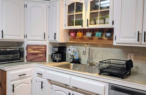 Russellville Casa | Enjoy the tranquil forest that surrounds this charming home in Dardanelle