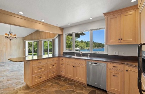 Lakeside Casa | Private Flathead Lake lagoon and dock, enjoy a spacious 5-bedroom Lakeside home.