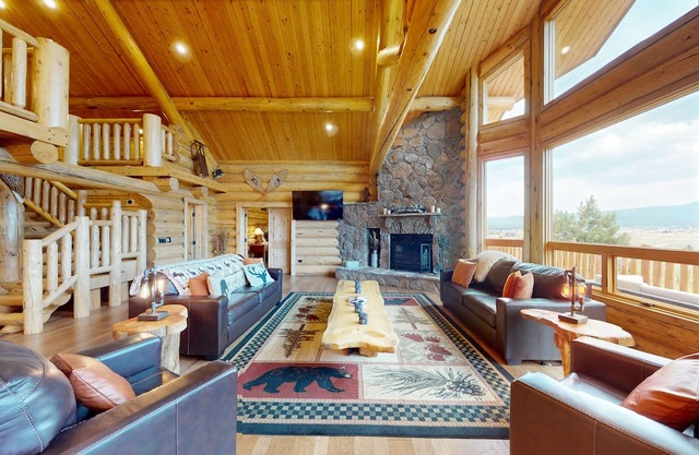 Luxury log cabin home with large deck, loft, mountain views, & grill