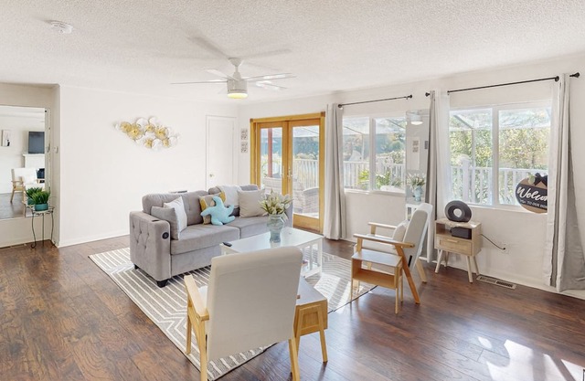 Dog-friendly lake view getaway with a full kitchen, sunroom, fireplace
