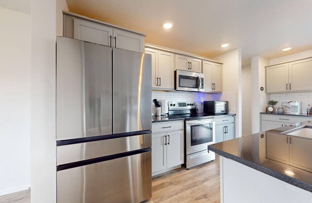 Newly built home with large fenced yard, 2 living rooms & great kitchen