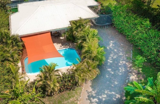 Macaws over head, monkeys in the distance, nature surrounding the pool…Pura Vida