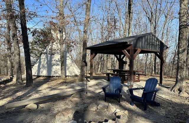 A teepee on 1200-acre ranch where secluded woods envelope the grounds.