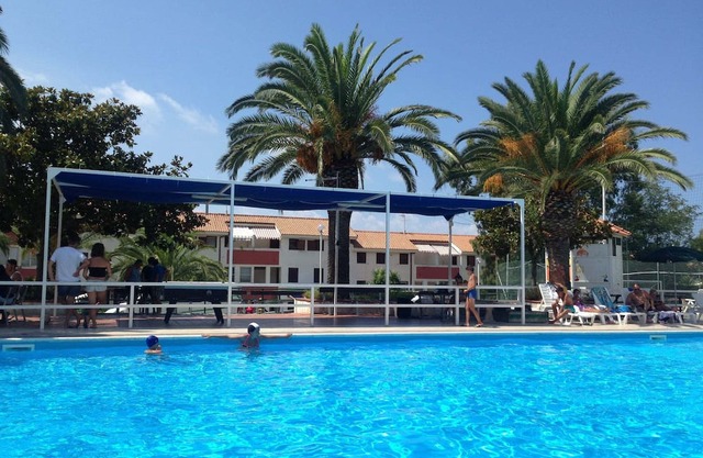Apartment "Bilocale 84 Residence La Giungla" with Sea View, Shared Pool & Wi-Fi