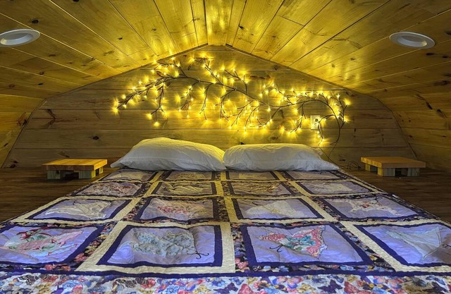 Secluded cabin in the woods with a loft on 25 acres with private walking trails.