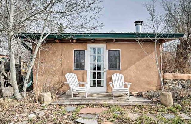 Log Casita Overlooking Pond and Waterfall near Taos, New Mexico