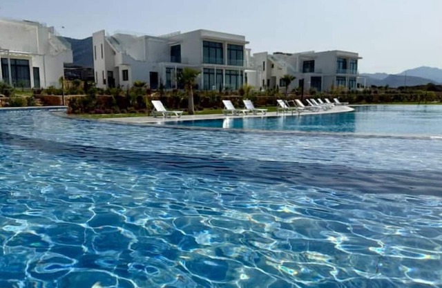 Chic penthouse in green resort: pool + gym