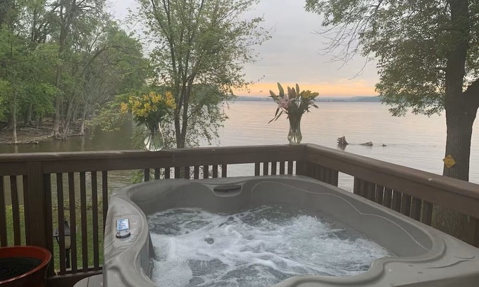 Lynn Center Casa | Best in QC! AweSpired Riverfront Retreat – Hot Tub, Fireplaces & Stunning Views!